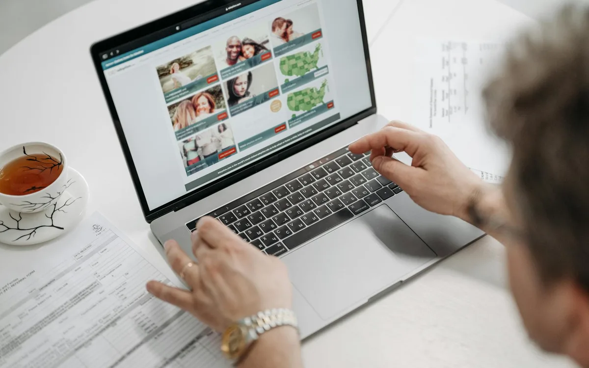 Person researching a brand online, reviewing search results and ratings