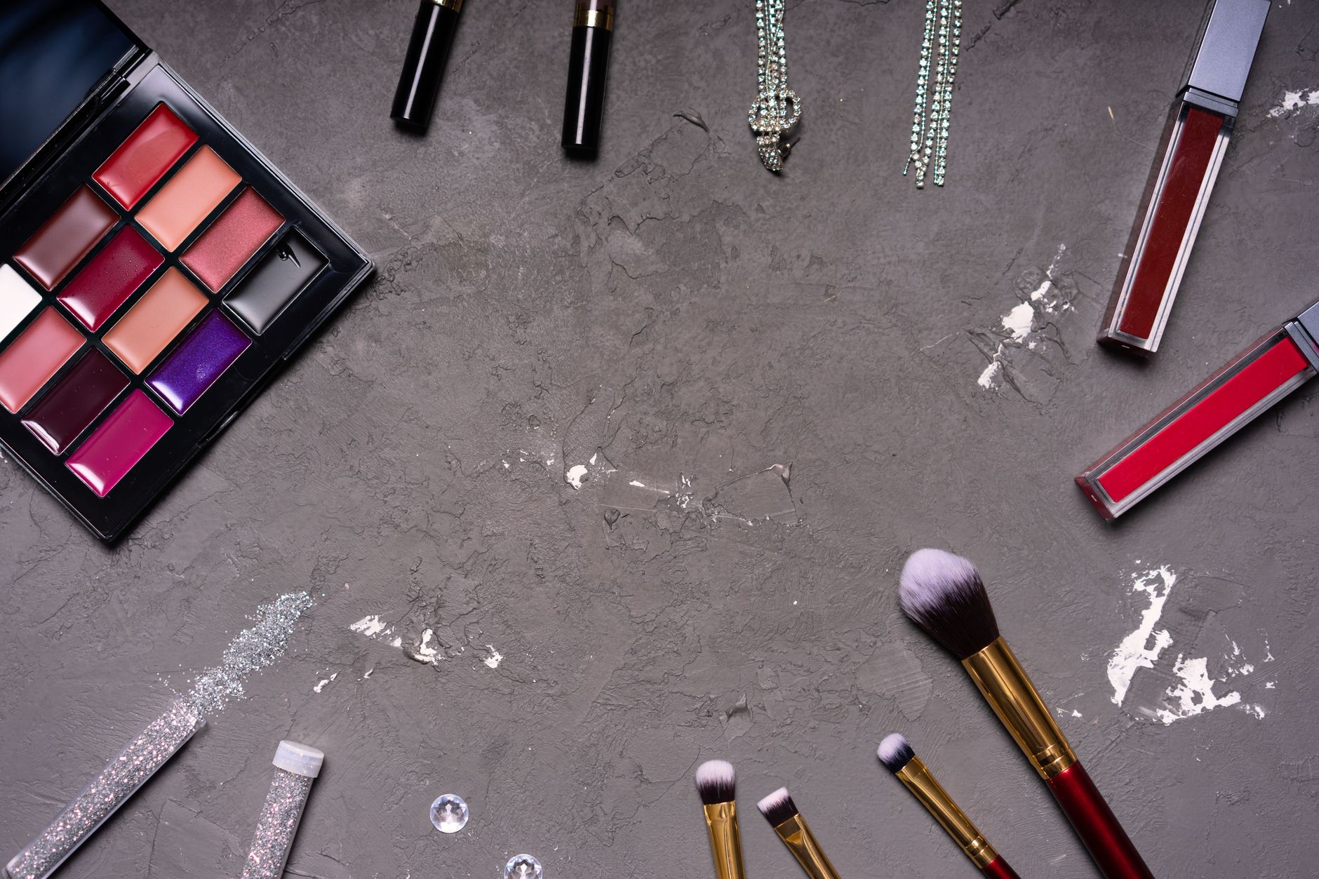 Cosmetics makeup palette and brush representing cosmetics brand review velocity programs